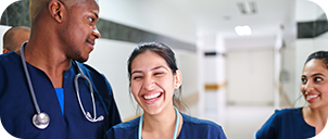 nurses laughing in a hallway hospital